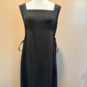 Black silk long sleeveless dress.